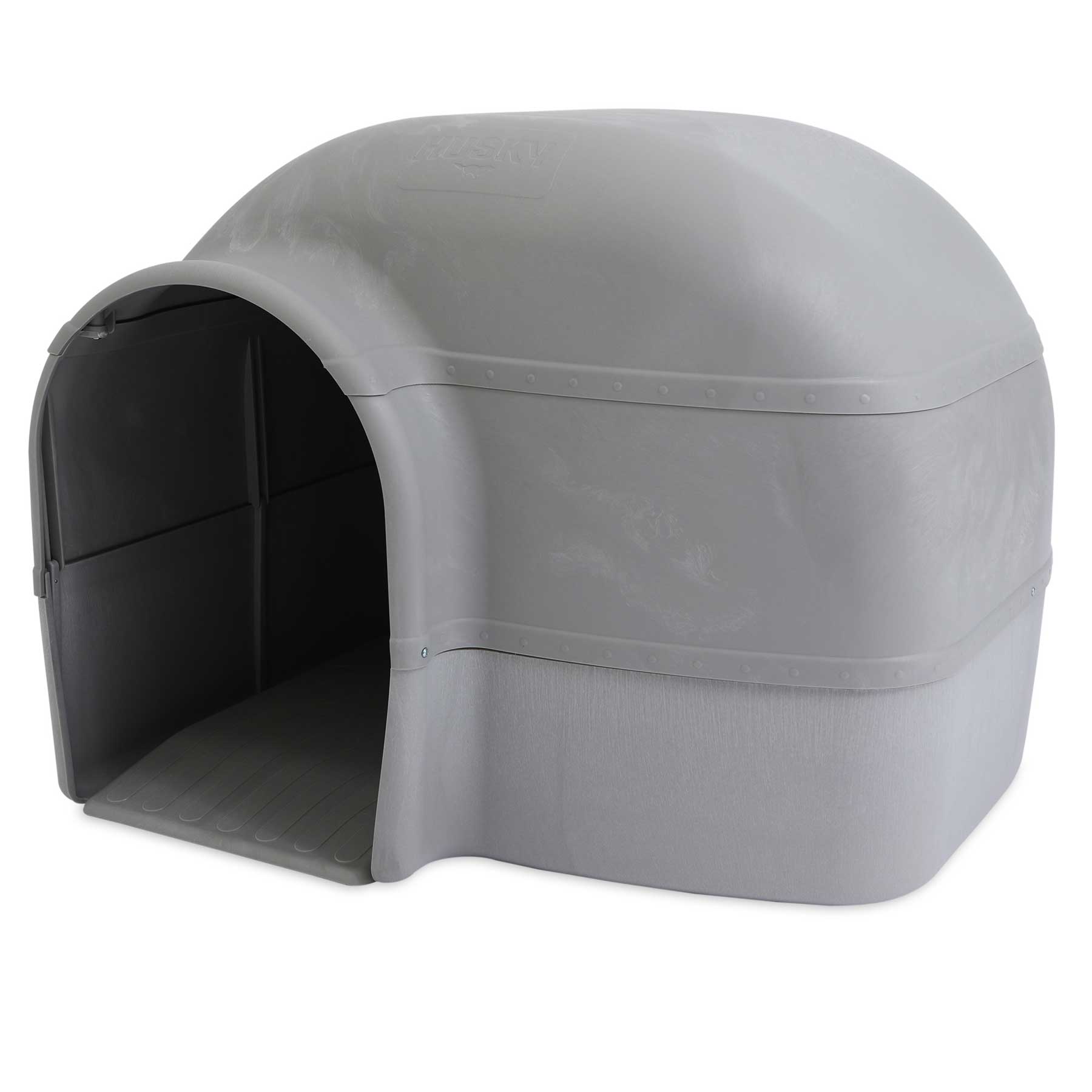 The Pet-mates Husky Dog House is a large, igloo-shaped shelter in light gray with an arched entrance, smooth surface, and textured base. It features a sturdy, elevated floor designed by Pet-mates for outdoor use.