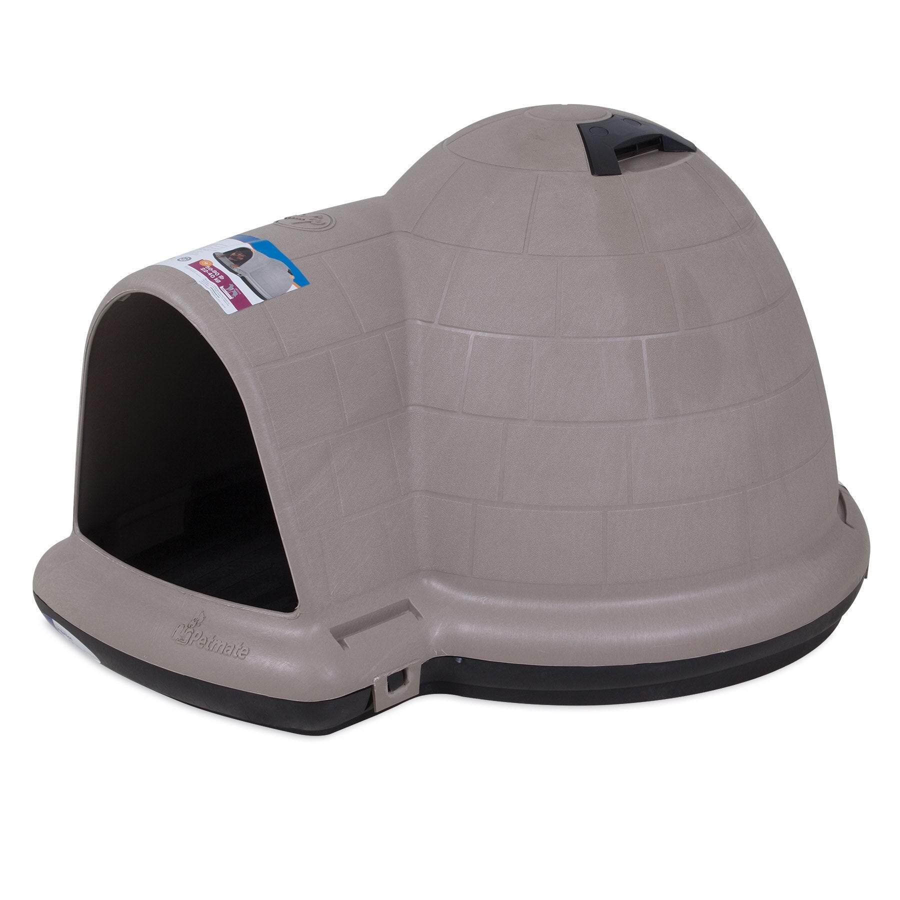 The Pet-mates Indigo Dog House by Pet-mates is a beige, igloo-shaped outdoor pet sanctuary with a black base and left-side entrance. It features a top handle and label with text and image, made from durable plastic, ideal for backyard settings.