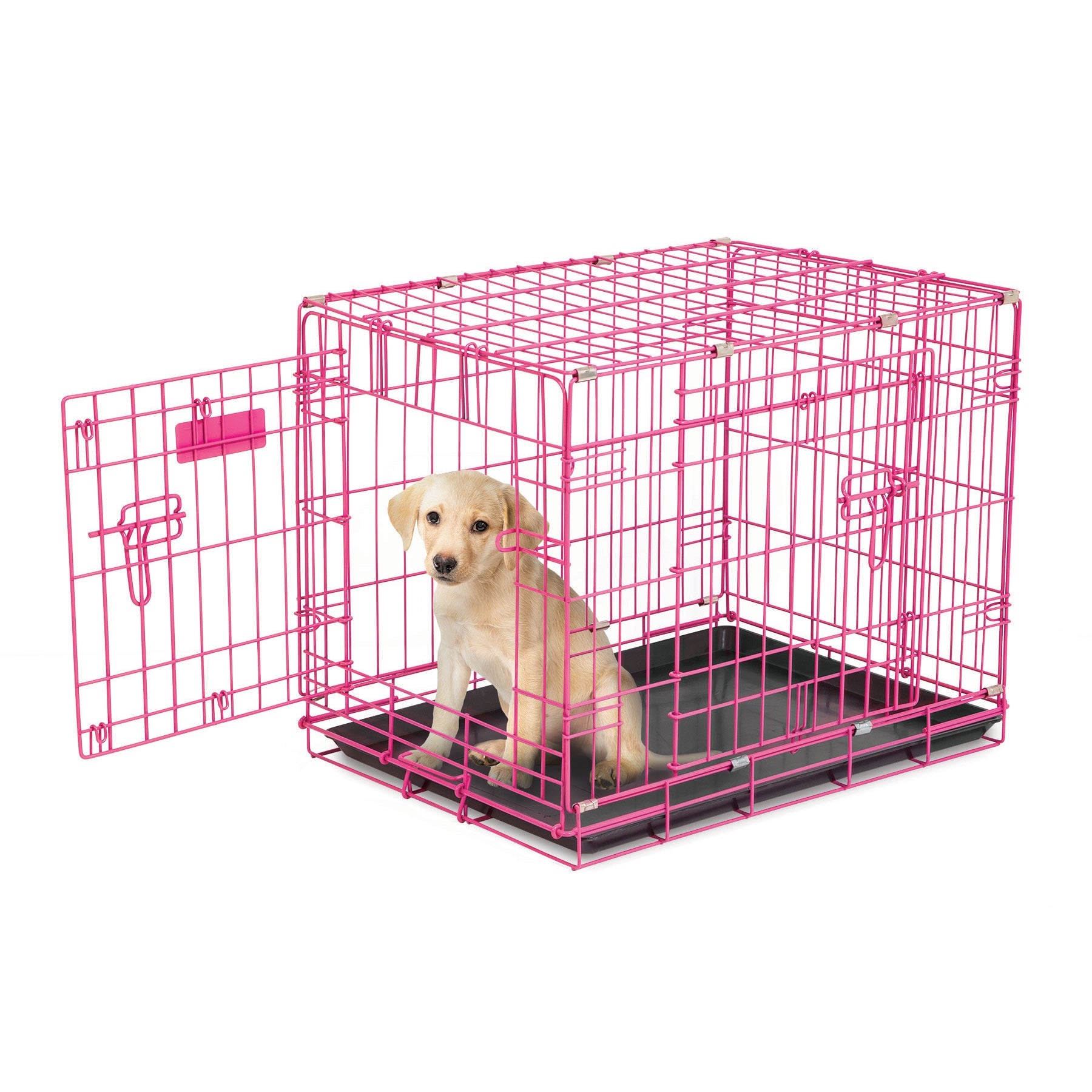A small puppy sits inside a Pet-mates 2 Door Wire Puppy Crate with the door open. The pink crate is ideal for house training, resting on a black base, as the puppy looks towards the camera.