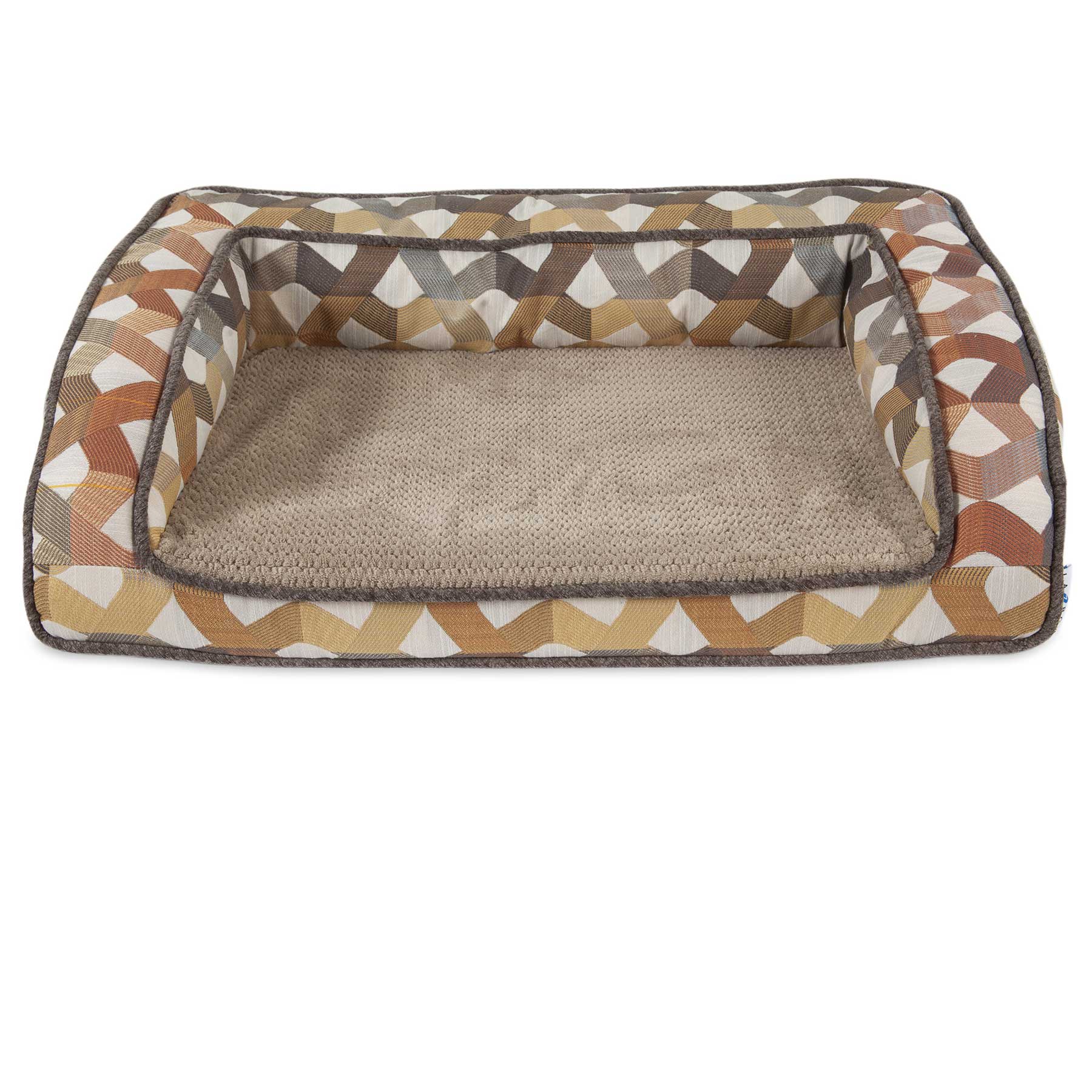The La-Z-Boy Riley Orthopedic Sofa Dog Bed is a rectangular comfort zone for pets, featuring raised edges and a stylish geometric pattern in brown, beige, and cream. Its beige Gel Memory Foam interior ensures coziness for your furry friend, with dark brown-trimmed edges.