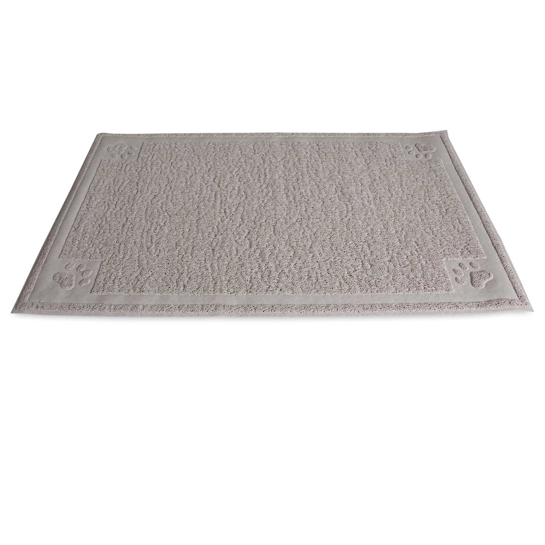 The Pet-mates Paws Large Litter Catcher Mat in tan is displayed. Made from soft, rubberized material, it has a rectangular textured surface with a subtle border and decorative raised paw prints at the corners. BPA and phthalate-free, it seamlessly lies on a white background.