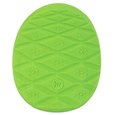 The JW Prickl-ee Pear Puppy Teether Chew Toy by Jw is a green oval mat with a textured diamond pattern and small circular bumps, ideal for puppies. JW is embossed in the center, subtly promoting dental health during mealtime.