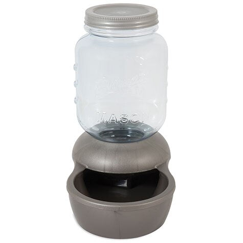 The Pet-mates 1-Gallon Mason Jar Gravity Pet Waterer has a BPA-free Mason-labeled clear glass jar and a gray plastic base with an integrated bowl for easy dispensing of fresh water.